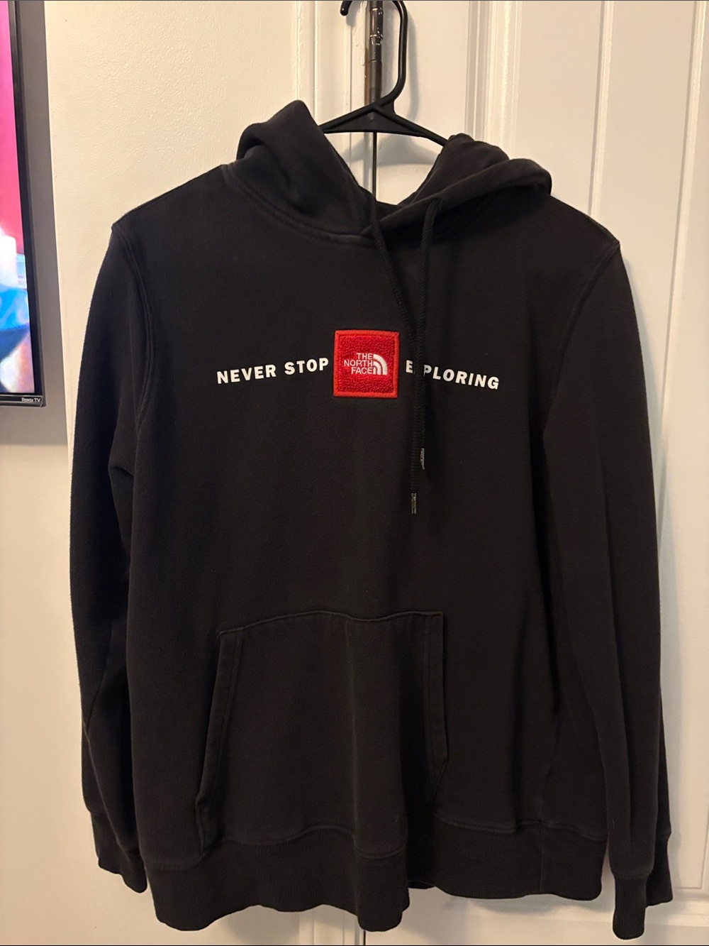 The North Face Black Crewneck Hoodie with Red Logo Patch